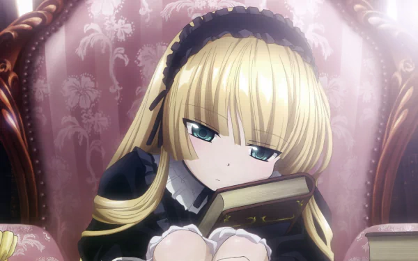 A contemplative character from the anime Gosick, resting on a richly upholstered chair with a book in her lap, showcases a blend of elegance and intrigue in this HD desktop wallpaper.