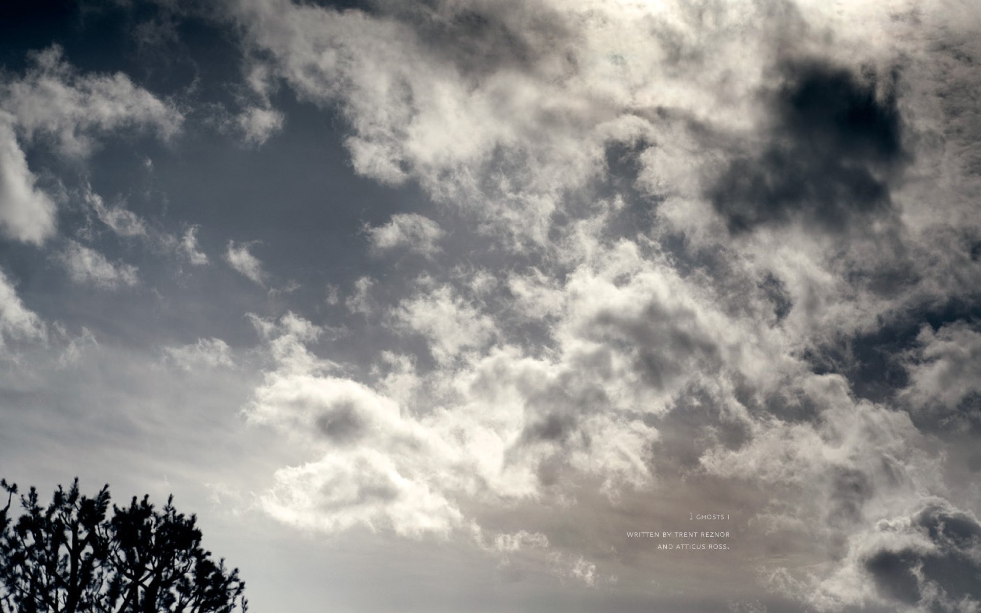 HD PC desktop wallpaper featuring a cloudy sky with subtle Nine Inch Nails music theme elements blending into the moody atmosphere.