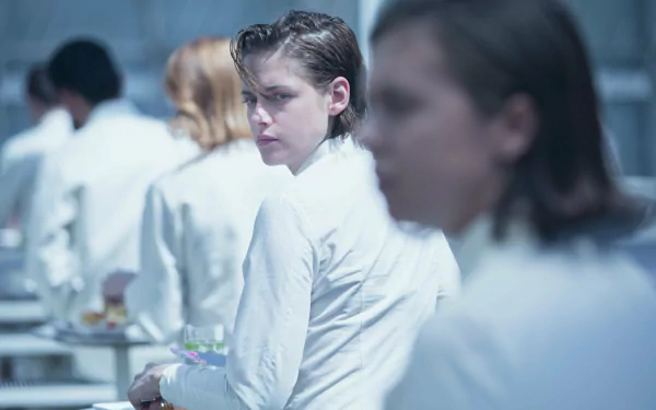 HD desktop wallpaper featuring Kristen Stewart in a scene from the movie Equals, set in a sterile, futuristic environment with characters dressed in white.