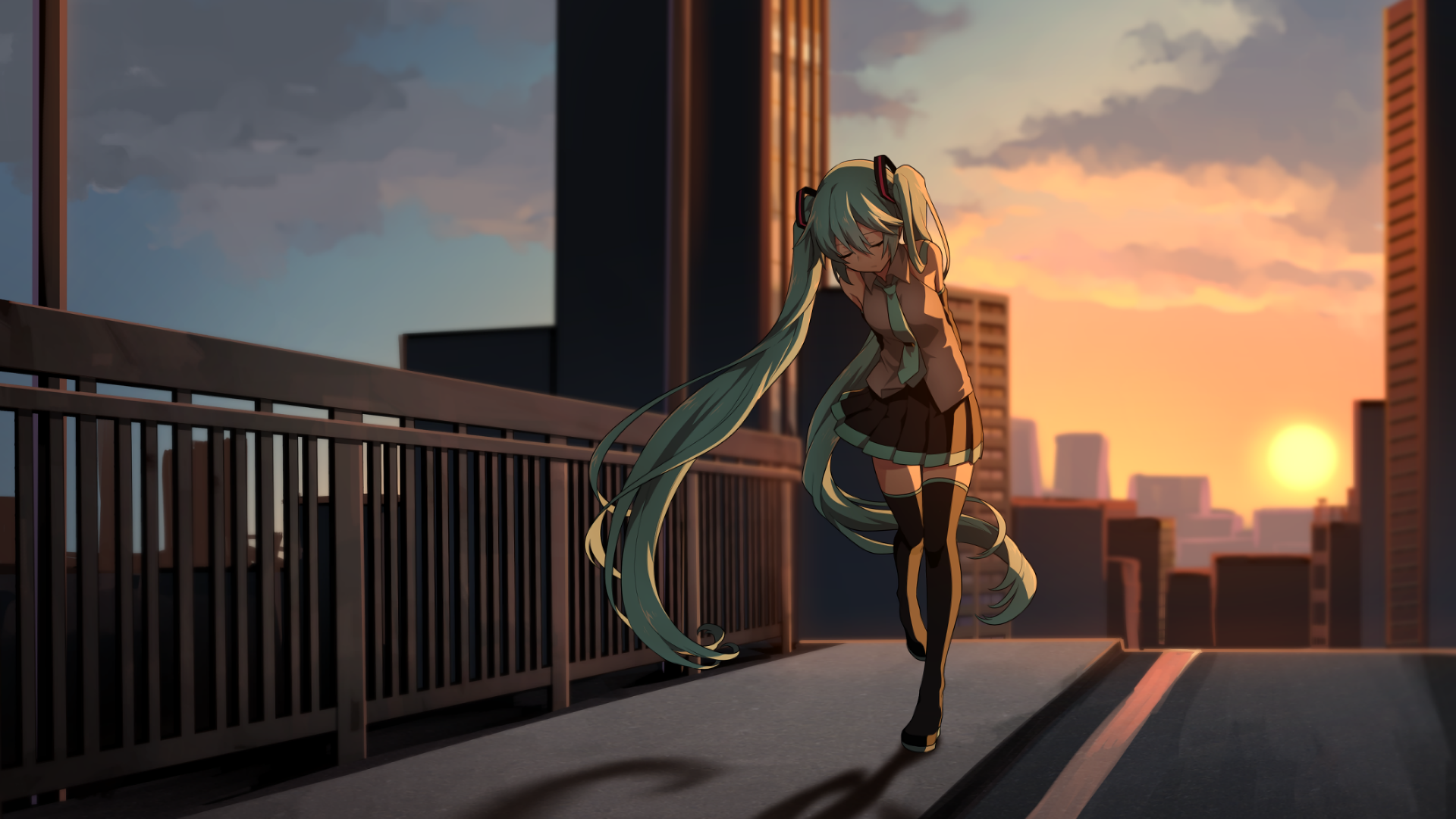 A vibrant HD desktop wallpaper featuring Hatsune Miku, the popular anime Vocaloid character, walking along a cityscape at sunset, capturing a blend of urban charm and artistry.