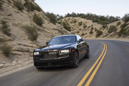 Black Rolls-Royce Wraith cruising on a winding mountain road, captured in stunning 4K Ultra HD for a striking PC desktop wallpaper.