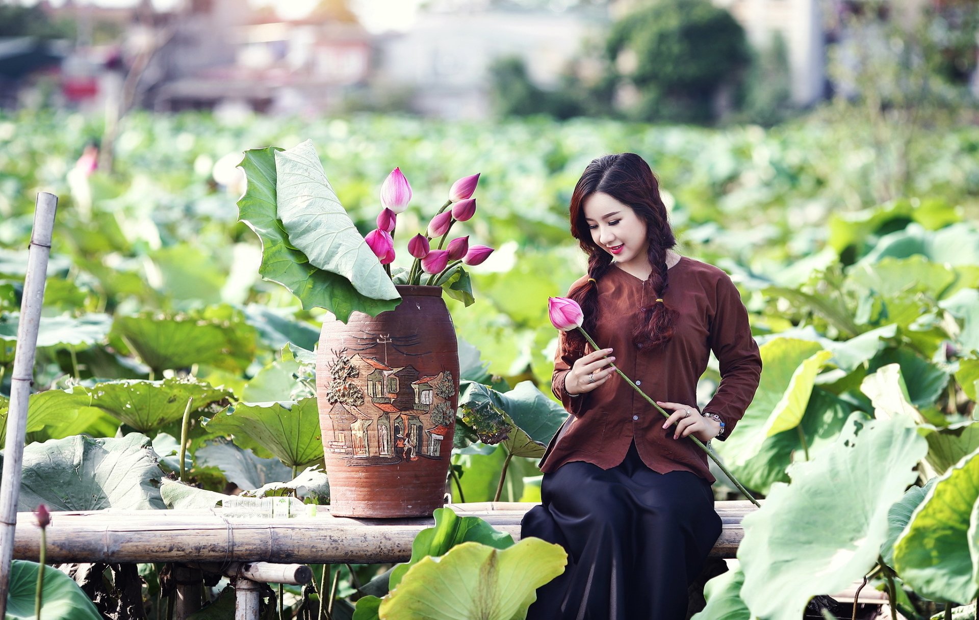 Serene Lotus Beauty: Asian Woman with Pink Blooms in Lush Outdoor Oasis ...
