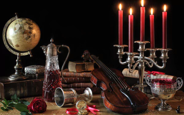 HD desktop wallpaper featuring a still life composition with a globe, violin, lit red candles in a silver candelabra, vintage books, and antique glassware on a dark background.