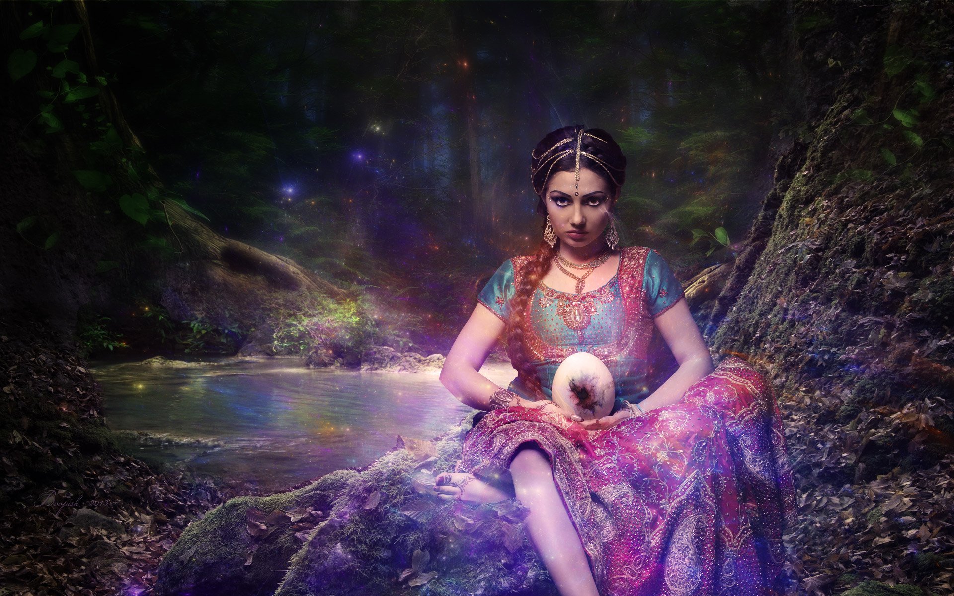 A fantasy-themed HD wallpaper featuring a woman with a bindi holding a glowing egg, seated by a mystical lake surrounded by a dark forest.