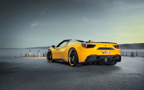 Yellow Ferrari 488 Spider supercar parked on an empty road, showcased as a vibrant 4K Ultra HD desktop wallpaper background.