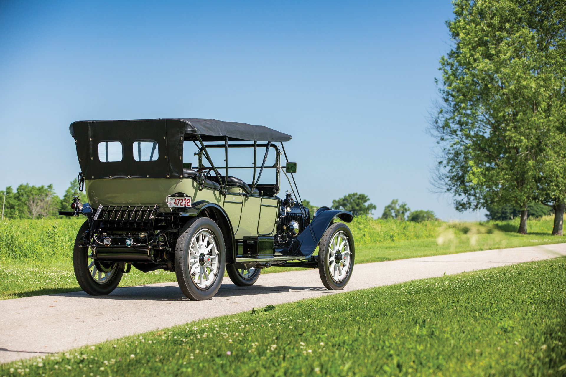 Vintage 1914 Packard Six 5-passenger Touring car parked on a country road, captured in HD for a classic automotive desktop wallpaper background.