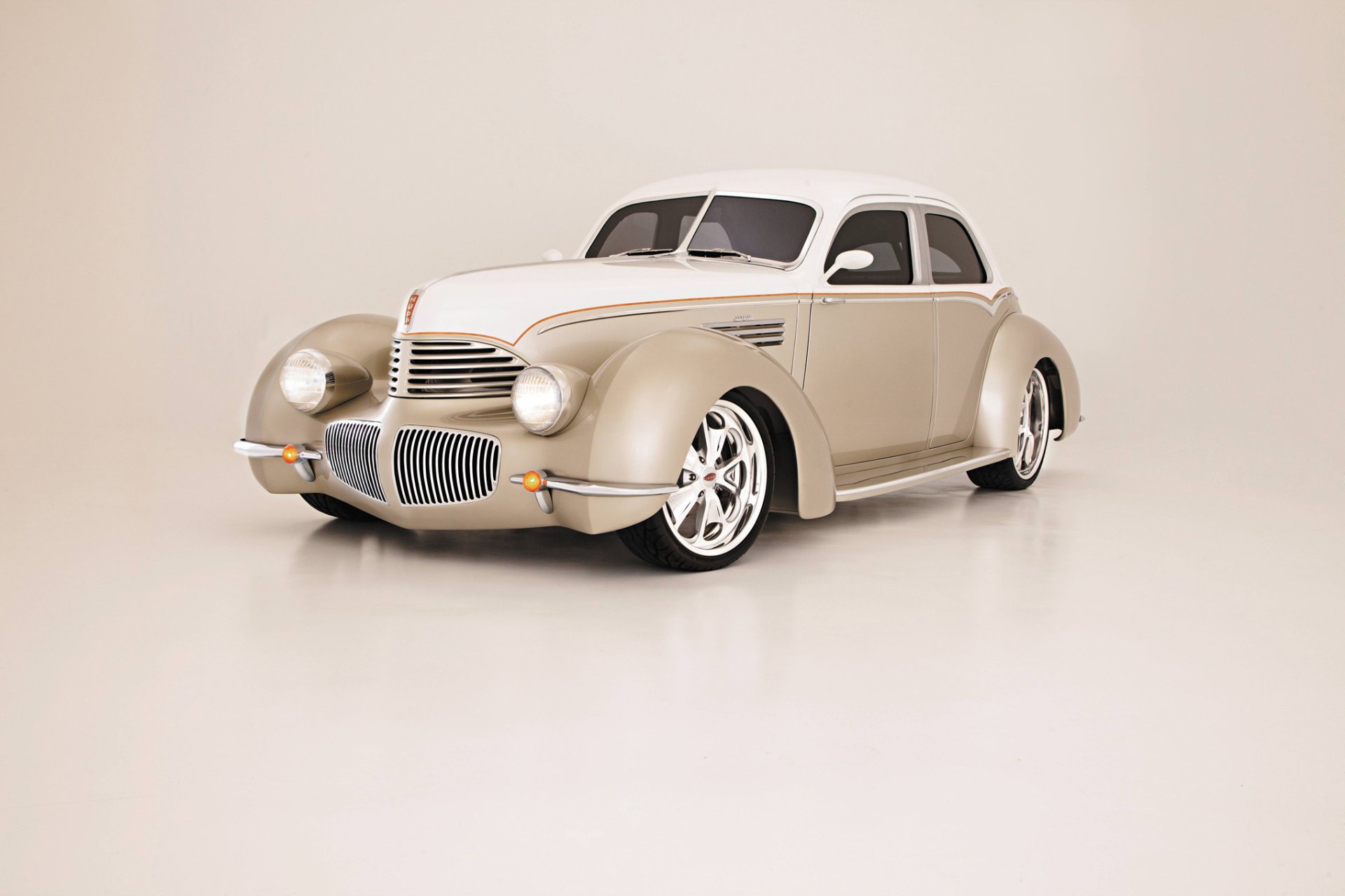 1941 Hupmobile Skylark vintage car in cream on a neutral backdrop — HD PC desktop wallpaper highlighting the vehicle's streamlined Art Deco styling.