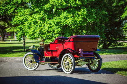 Red 1910 Packard Model 18 Touring NB vintage car parked on a sunlit park path — 4K Ultra HD PC desktop wallpaper background.
