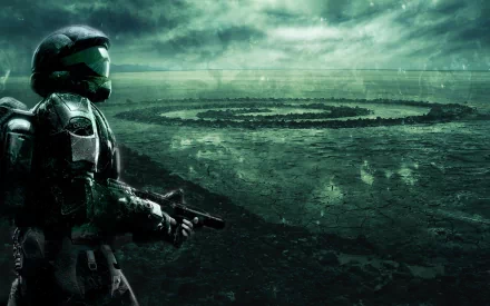 A striking HD wallpaper featuring a Halo character standing against a moody, atmospheric backdrop with a mysterious spiral structure in the landscape.