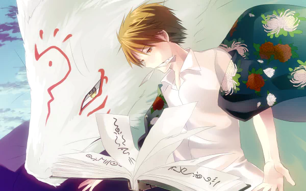 HD anime desktop wallpaper featuring Natsume from Natsume Yuujinchou (Natsume's Book of Friends) holding an open book with a large white fox spirit behind him.