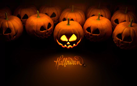 HD PC desktop wallpaper featuring glowing jack-o'-lanterns with carved faces, creating a spooky Halloween holiday atmosphere.