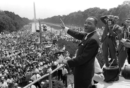 HD desktop wallpaper and background showing Martin Luther King Jr. addressing a large crowd during his iconic speech in Washington D.C.