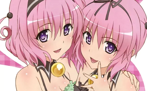 Nana and Momo Astar Deviluke from the anime To Love-Ru pose together in this vibrant HD wallpaper, showcasing their playful personalities and iconic pink hair.
