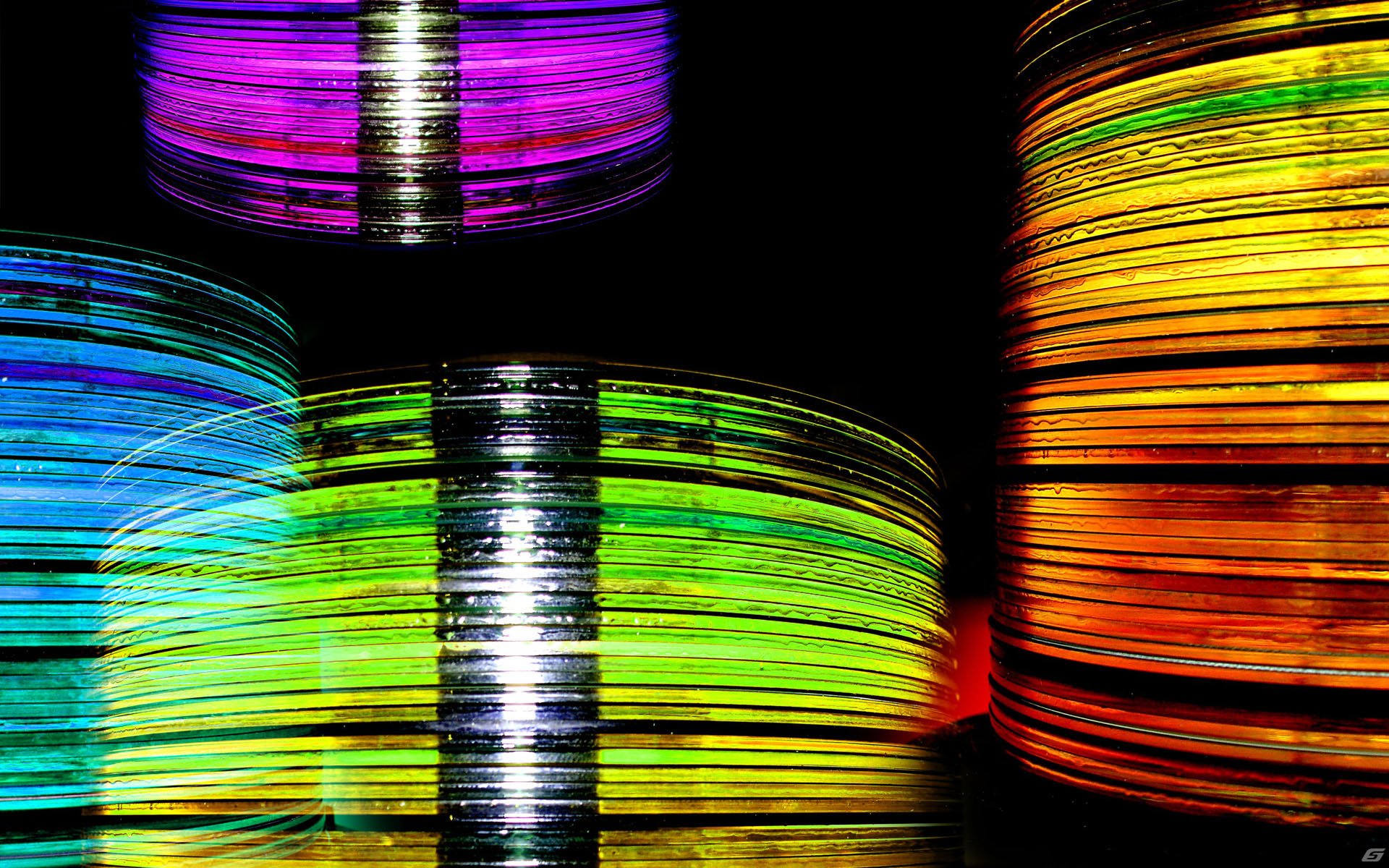 Vibrant abstract artwork featuring colorful streaks of light in purple, blue, green, yellow, and orange hues against a black background, designed as an HD PC desktop wallpaper.
