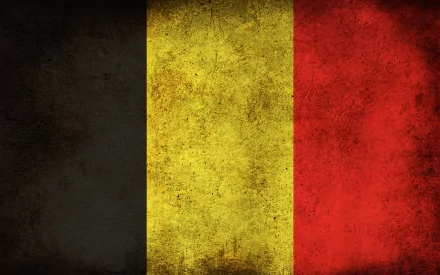 High-definition desktop wallpaper featuring the flag of Belgium, showcasing the distinctive black, yellow, and red vertical stripes with a textured background.