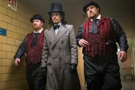 HD desktop wallpaper featuring Benedict Samuel as Jervis Tetch, the Mad Hatter from the Gotham TV show, flanked by two similarly dressed men in a dim hallway.