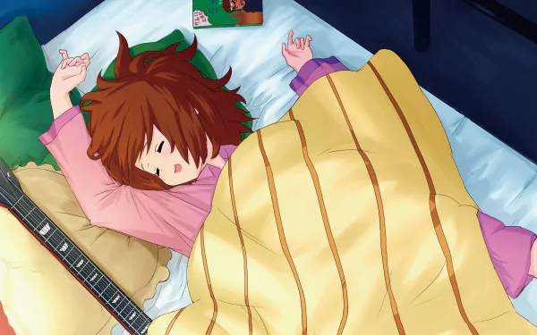 HD PC desktop wallpaper/background: Yui Hirasawa from K-ON! sleeping in bed, guitar at her side, cozy under a yellow blanket in anime art.