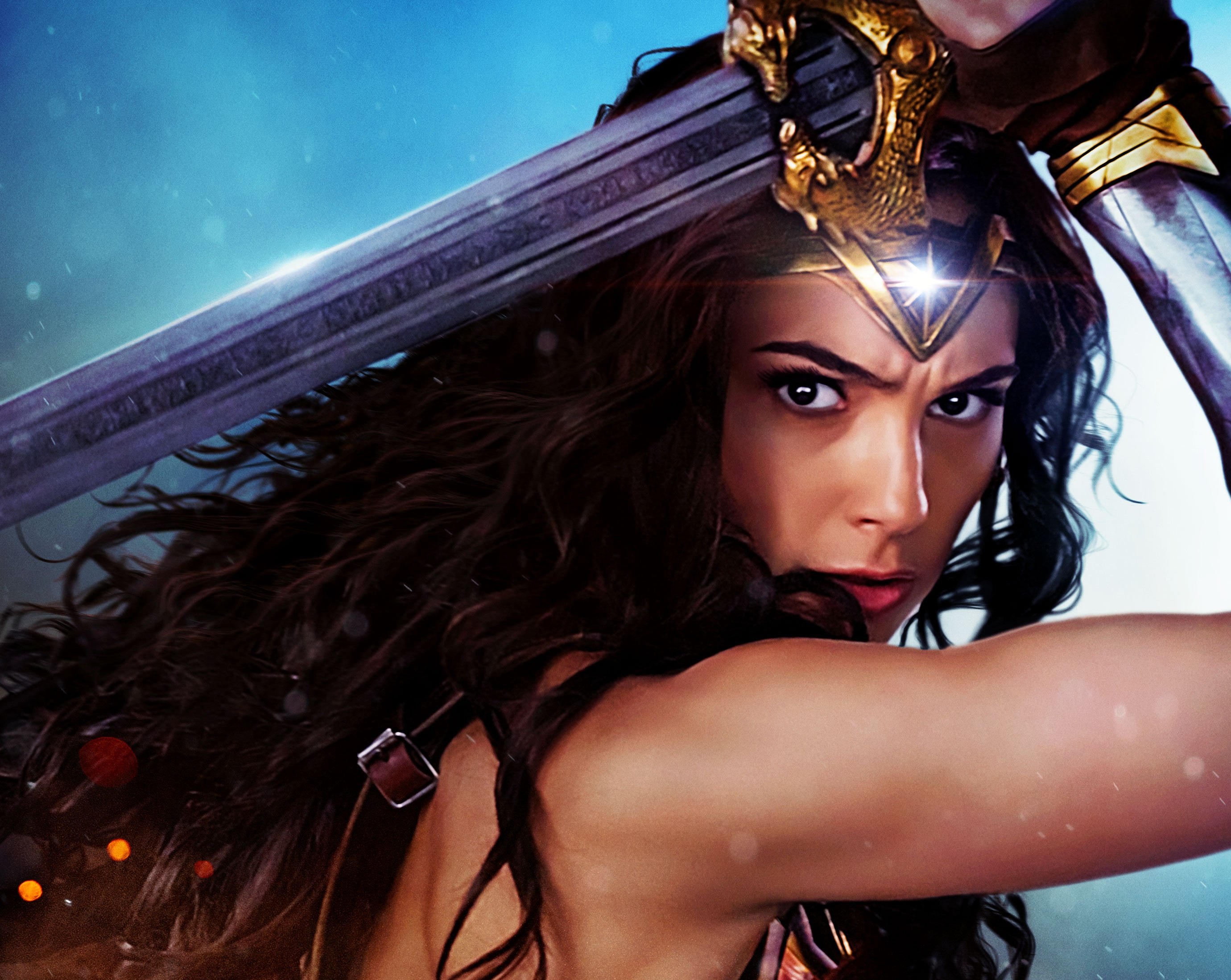 HD desktop wallpaper of Diana of Themyscira, portrayed by Gal Gadot as Wonder Woman, holding a sword with a determined expression.