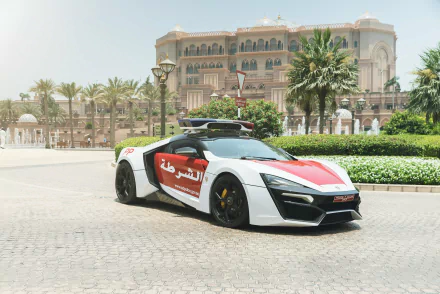 HD PC desktop wallpaper showing a white-and-red Lykan HyperSport sports car parked before a grand palace with palm trees, fountains and landscaped background.