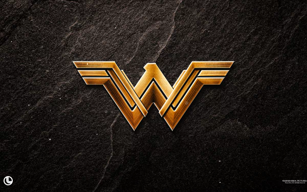 The image features the iconic golden W emblem of Wonder Woman set against a textured dark background, making it a striking HD desktop wallpaper for fans of the movie.