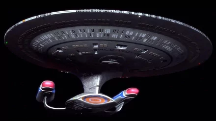 A stunning HD wallpaper featuring a classic Star Trek starship, showcasing its intricate design against a dark background, capturing the essence of sci-fi exploration.