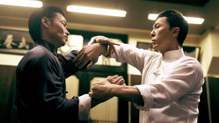 4K Ultra HD PC desktop wallpaper from the movie Ip Man 3 showing two martial artists practicing Wing Chun, gripping each other's arms in a dim training room.