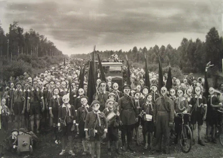 HD PC desktop wallpaper depicting a large group of people wearing gas masks in a military-style formation outdoors under a cloudy sky.