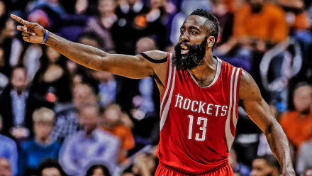 HD desktop wallpaper featuring James Harden in a Houston Rockets jersey pointing on the court.
