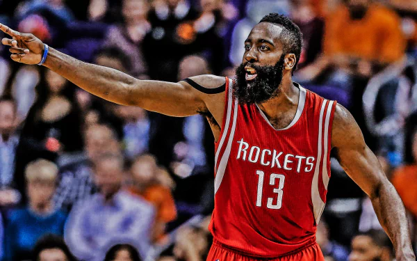 HD desktop wallpaper featuring James Harden in a Houston Rockets jersey pointing on the court.
