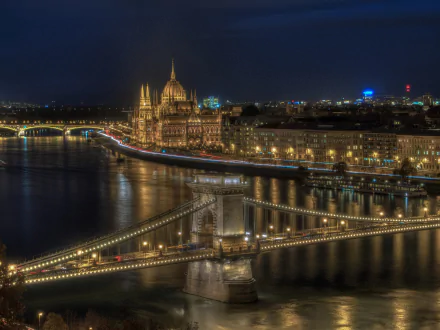 HD desktop wallpaper: Night view of Budapest, Hungary — illuminated Chain Bridge and Hungarian Parliament Building along the Danube river, city skyline and man-made landmarks.
