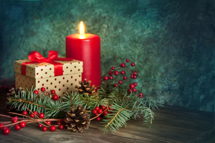 HD desktop wallpaper featuring a festive Christmas scene with a lit red candle, a gift box wrapped in polka dot paper with a red ribbon, pine cones, and evergreen branches with red berries.