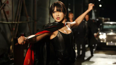 HD desktop wallpaper featuring Deepika Padukone in an intense action pose from the movie Chandni Chowk To China.