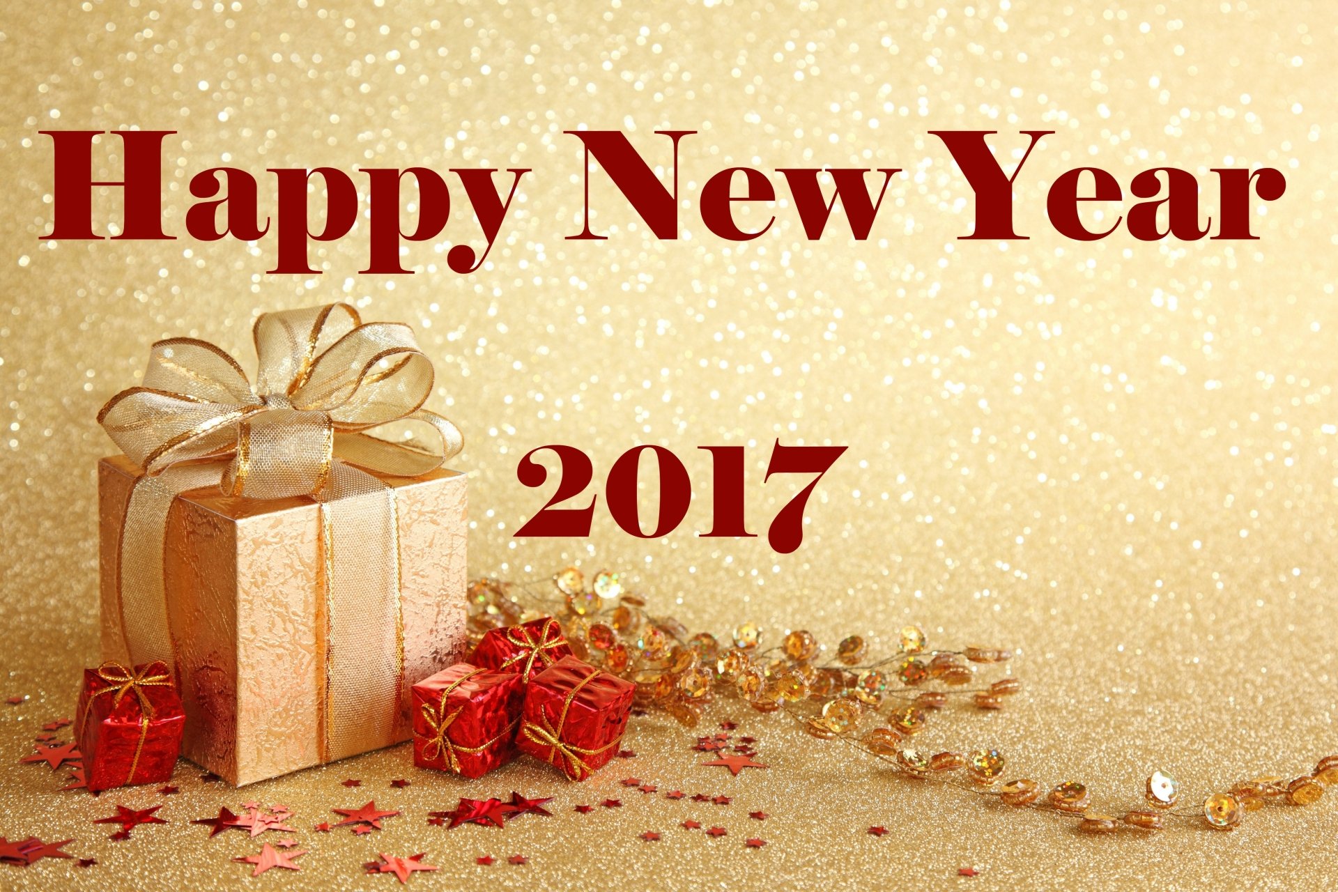 Gold and red glittering New Year 2017 gift boxes with festive decorations on a sparkling background, 4K Ultra HD desktop wallpaper.