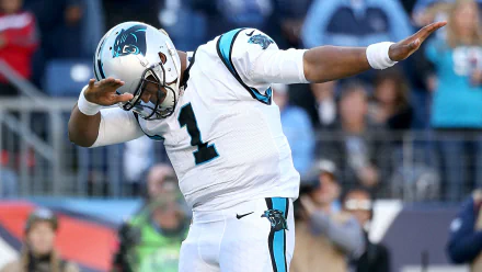 HD wallpaper of Cam Newton in a Carolina Panthers uniform celebrating during a football game.