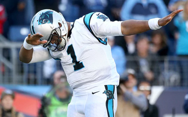 HD wallpaper of Cam Newton in a Carolina Panthers uniform celebrating during a football game.