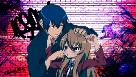 HD wallpaper of characters Taiga Aisaka and Ryuuji Takasu from the anime Toradora! standing in front of a graffiti-covered brick wall.