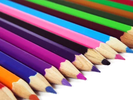 Close-up photography of colorful sharpened pencils arranged in a row, presented as a vibrant HD PC desktop wallpaper and background.
