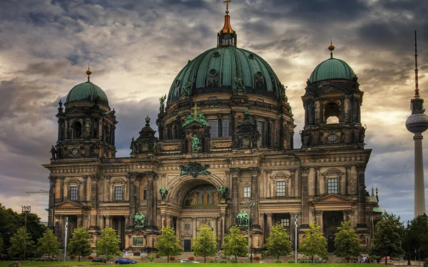 Berlin Cathedral, a grand religious landmark in Germany, stands majestically under a dramatic sky, captured in an HD desktop wallpaper and background.