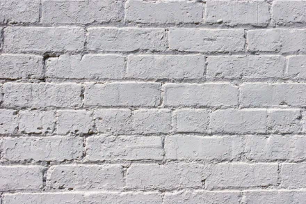 HD desktop wallpaper showcasing a close-up view of a white-painted brick wall, highlighting the textured, man-made pattern.