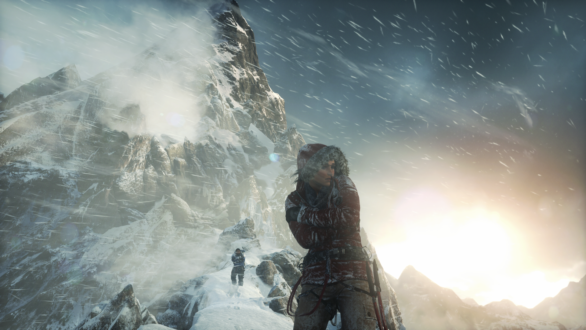 HD desktop wallpaper of Lara Croft from the video game Rise of the Tomb Raider, depicting a snowy mountain scene with intense, stormy weather.