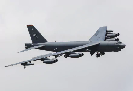 A Boeing B-52 Stratofortress military bomber aircraft of the air force in flight against a cloudy sky, captured in 4K Ultra HD detail.