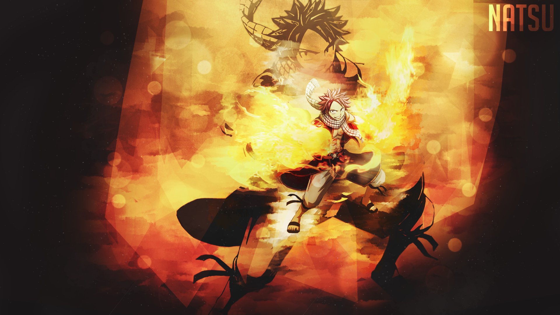 An HD desktop wallpaper featuring Natsu Dragneel from the anime Fairy Tail, surrounded by fiery flames in an action stance. The background is vivid with a dynamic mix of colors and light effects.