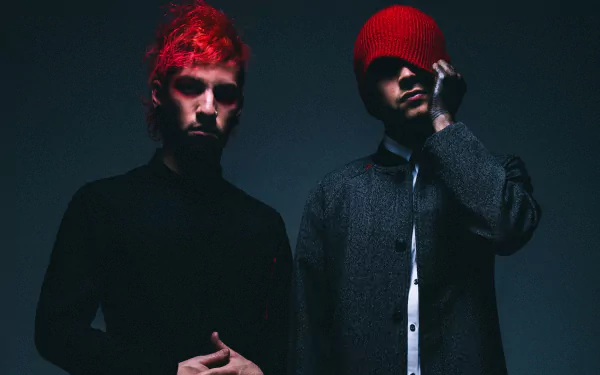 HD desktop wallpaper featuring the music duo Twenty One Pilots, posing dramatically against a dark backdrop.