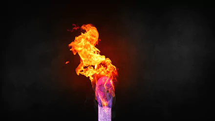 Close-up photography of a brightly burning match flame captured in stunning 8K Ultra HD, set against a dark background for striking contrast.