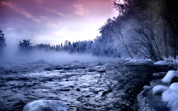 HD desktop wallpaper of a frozen river landscape under foggy, snowy, and icy conditions, capturing the cold beauty of winter nature with snow-covered trees and a serene, misty atmosphere.