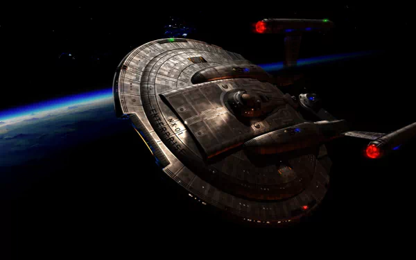 HD desktop wallpaper featuring the starship Enterprise from the TV show Star Trek: Enterprise orbiting a planet in deep space.