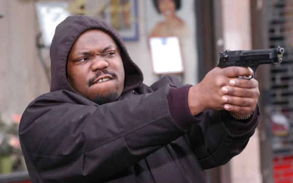 HD PC desktop wallpaper from the movie State Property 2: hooded man in a dark jacket pointing a pistol in an urban street scene.