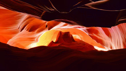HD desktop wallpaper showcasing the vibrant, sculpted sandstone walls of Arizona’s Antelope Canyon bathed in warm natural light.