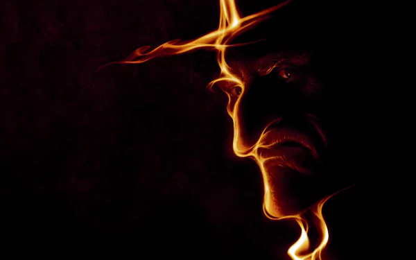 HD desktop wallpaper featuring a dark, fiery profile of Ebenezer Scrooge from the 2009 movie A Christmas Carol.