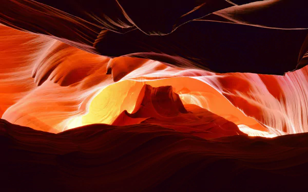 HD desktop wallpaper showcasing the vibrant, sculpted sandstone walls of Arizona’s Antelope Canyon bathed in warm natural light.